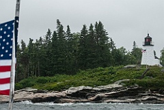 Colorful American Flags on Dreary Day by Burnt Island Light